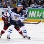 MINSK, BELARUS - MAY 10: Finland's Jori Lehtera #21 chips the puck forward during preliminary round action against Latvia at the 2014 IIHF Ice Hockey World Championship. (Photo by Andre Ringuette/HHOF-IIHF Images)